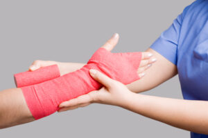 Applying bandage San Antonio Accident Attorney